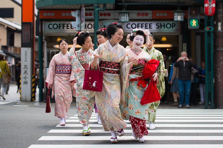 A group of geisha in Gion. Candid moments like these have their own kind of magic